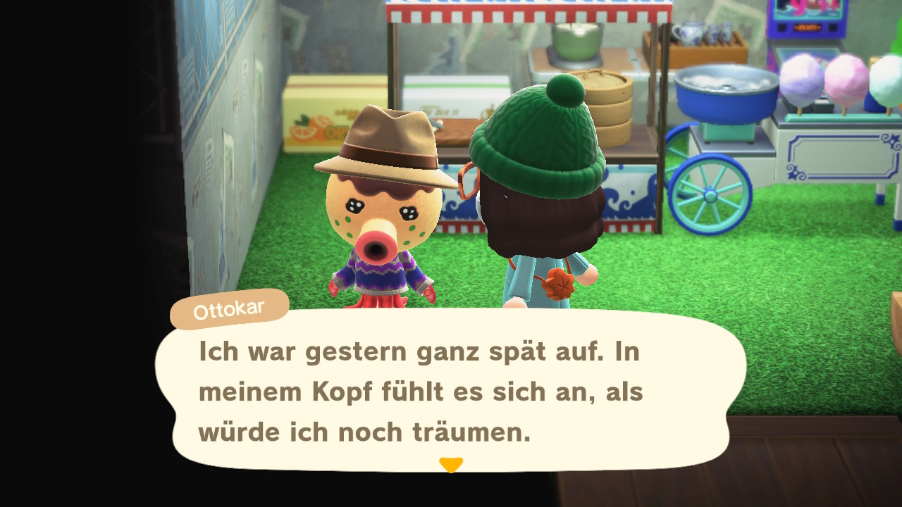 Zwei Figuren stehen vor einem Süßwarenladen. Ottokar: "Ich war gestern ganz spät auf. In meinem Kopf fühlt es sich an, als würde ich noch träumen."