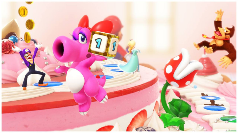 Bunte Figuren aus Mario Party auf einem riesigen, pinken Kuchen.