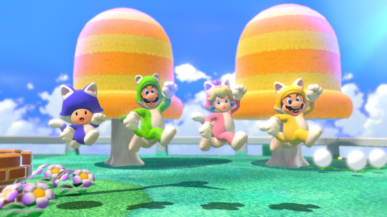 Toad, Luigi, Peach und Mario in bunten Katzenkostümen.