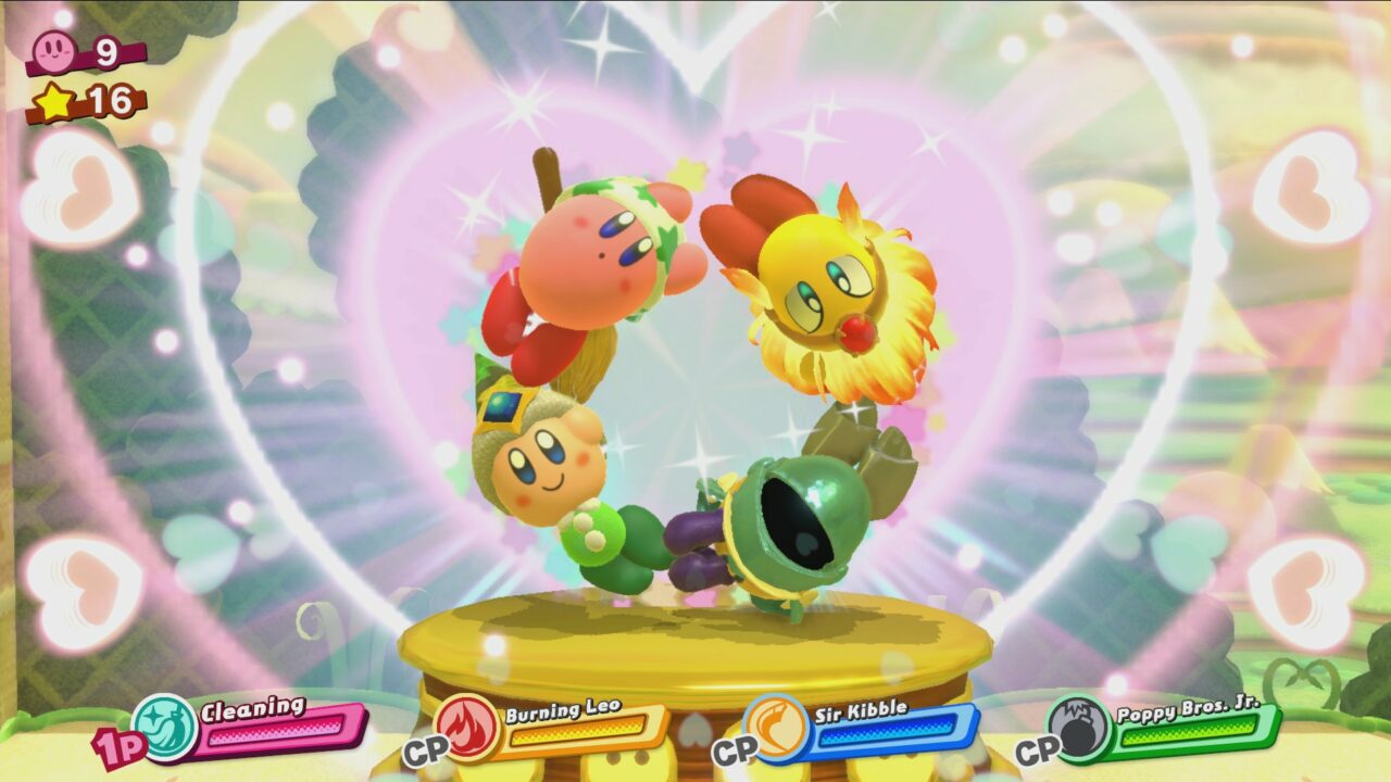 Kirby und drei weitere Freunde bilden gemeinsam ein Kreis indem sie sich an Hände und Füße fassen.