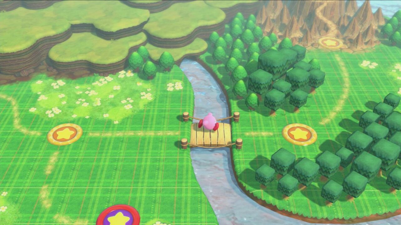 Kirby rennt über eine Brücke im Wald.