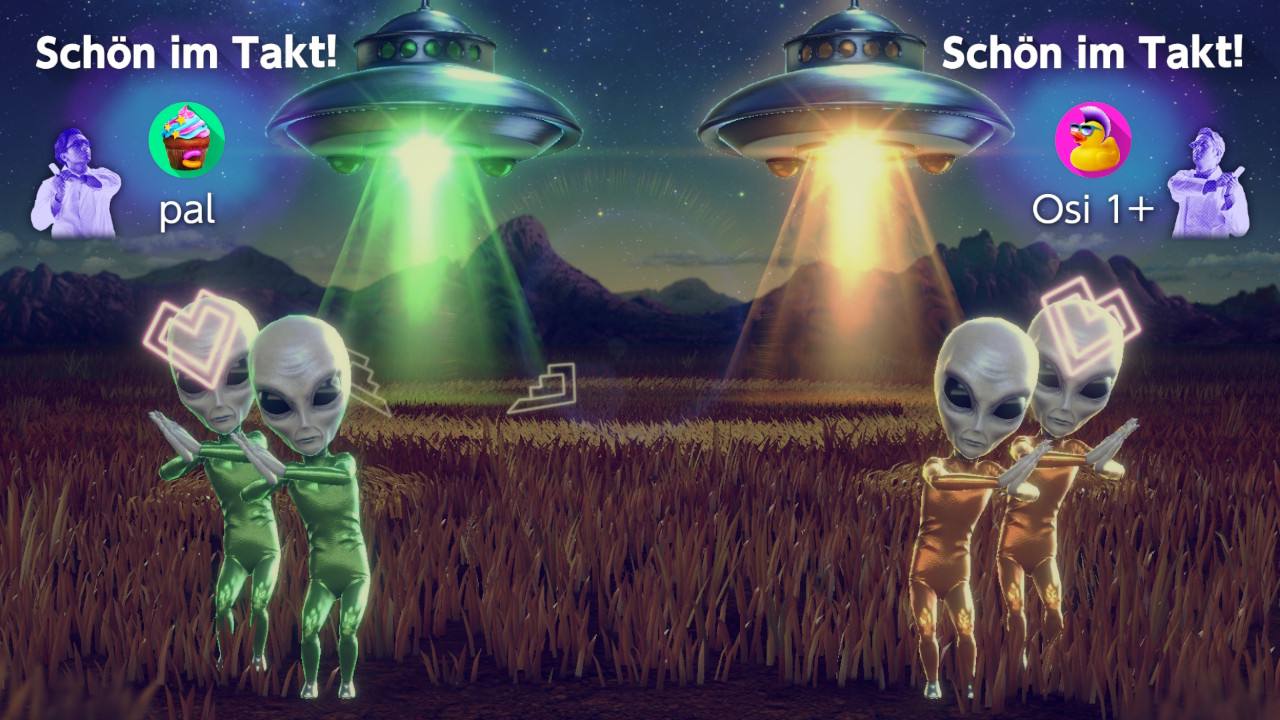 Vier Aliens bewegen sich durch ein Feld und führen Gesten mit den Armen aus.