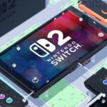 Eine große Nachbildung der Nintendo Switch 2 und Zubehör.